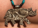 rhinoceros silver necklace turquoise center stone dragon design on back of pendant